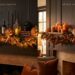 Side-by-side comparison of a fireplace mantel decorated for holidays: the left side shows a moody Halloween aesthetic with black candles, a black vase with burgundy fall foliage, glowing jack-o'-lanterns, and a leaf garland with smart fairy lights; the right side shows a warm, cozy Thanksgiving aesthetic with the same base leaf garland, amber flameless candles, brass holders, natural pinecones, and a decorative turkey.